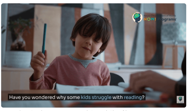 Child working on writing while developing early literacy skills and reading ability
